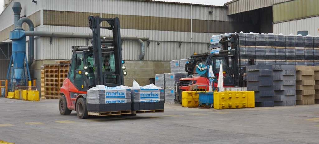 Linde forklifts parked outside at Marlux